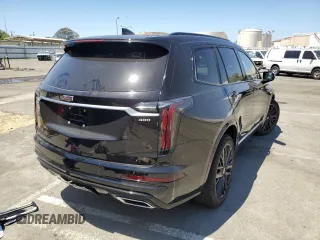 2023 Cadillac XT6 AWD Sport z VIN 1GYKPGRS2PZ130847, wystawiony jako Copart lot #58174474 z przebiegiem 11 958 mil mil oraz Tytuł czysty. Historia ofert i sprzedaży dostępna na DreamBid. Obrazek 3.