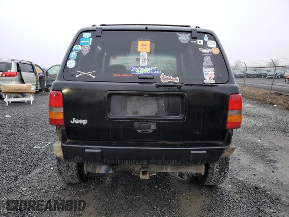 1998 Jeep Grand Cherokee Laredo with VIN 1J4GZ48S0WC171138, listed as a Copart auction lot 85502794 with 0 mi miles and Salvage Title. Bid and sale history available at carsss.com. Image 6.