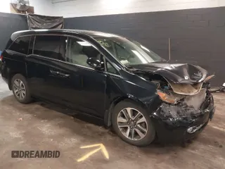 2014 Honda Odyssey Touring with VIN 5FNRL5H94EB105745, listed as a IAAI auction lot 41744012 with 77,032 mi miles and . Bid and sale history available at DreamBid. Image 1.