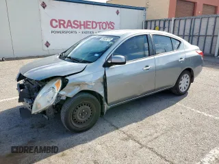 2012 Nissan Versa SV with VIN 3N1CN7AP7CL937795, listed as a Copart auction lot 59428275 with 115,596 mi miles and Salvage title. Bid and sale history available at DreamBid. Image 1.