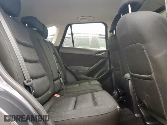 2014 Mazda CX-5 Touring z VIN JM3KE2CY7E0308580, wystawiony jako Copart lot #60565835 z przebiegiem 92 708 mil mil oraz Szkoda całkowita • Salvage title. Historia ofert i sprzedaży dostępna na DreamBid. Obrazek 11.