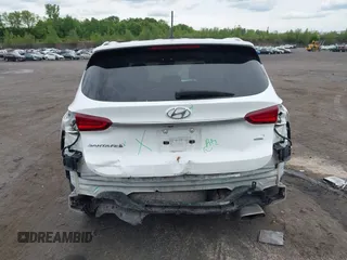 2019 Hyundai Santa Fe SE z VIN 5NMS2CADXKH005960, wystawiony jako IAAI lot #42341142 z przebiegiem 71 617 mil mil oraz . Historia ofert i sprzedaży dostępna na DreamBid. Obrazek 6.