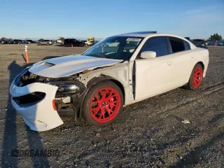 2019 Dodge Charger Scat Pack with VIN 2C3CDXGJXKH520282, listed as a Copart auction lot 87208244 with Not Provided miles and Salvage Title. Bid and sale history available at DreamBid. Image 1.