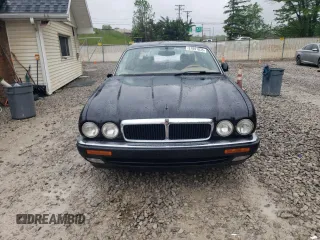 1997 Jaguar XJ with VIN SAJHX6248VC806189, listed as a Copart auction lot 57891035 with 51,654 mi miles and Salvage title. Bid and sale history available at DreamBid. Image 5.