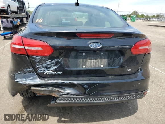 2018 Ford Focus SE z VIN 1FADP3F2XJL276652, wystawiony jako Copart lot #57499965 z przebiegiem 112 388 mil mil oraz Szkoda całkowita • Salvage title. Historia ofert i sprzedaży dostępna na DreamBid. Obrazek 6.