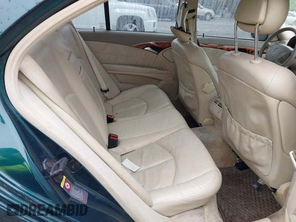 2003 Mercedes-Benz E-Class 3.2L with VIN WDBUF65J73A130214, listed as a IAAI auction lot 41731642 with 203,520 mi miles. Bid and sale history available at carsss.com. Image 8.