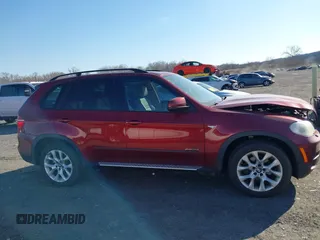 2011 BMW X5 35i with VIN 5UXZV4C52BL413125, listed as a IAAI auction lot 41697824 with 136,828 mi miles. Bid and sale history available at carsss.com. Image 13.