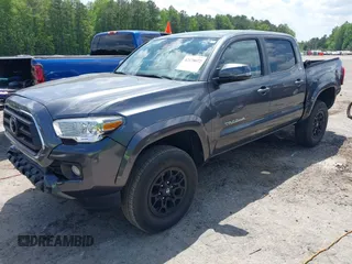 2021 Toyota Tacoma SR z VIN 3TMCZ5AN2MM392590, wystawiony jako IAAI lot #42178072 z przebiegiem 42 542 mil mil oraz . Historia ofert i sprzedaży dostępna na DreamBid. Obrazek 2.