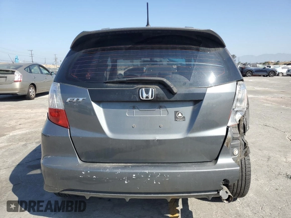 2013 Honda Fit Sport z VIN JHMGE8H53DC026920, wystawiony jako Copart lot #58505615 z przebiegiem 132 286 mil mil oraz Szkoda całkowita • Salvage title. Historia ofert i sprzedaży dostępna na DreamBid. Obrazek 6.