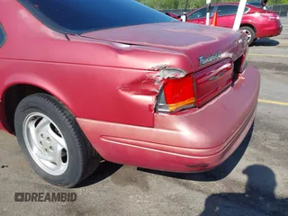 1996 Ford Thunderbird LX with VIN 1FALP62W0TH142986, listed as a IAAI auction lot 42030900 with 168,993 mi miles. Bid and sale history available at carsss.com. Image 19.