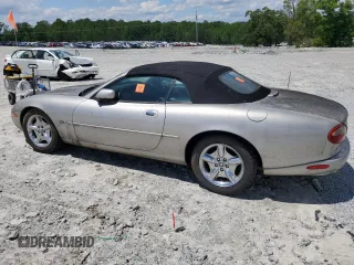 1999 Jaguar XK z VIN SAJGX2049XC034022, wystawiony jako Copart lot #55690025 z przebiegiem Nie podano mil oraz Tytuł czysty. Historia ofert i sprzedaży dostępna na DreamBid. Obrazek 2.