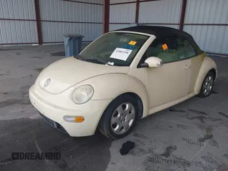 2003 Volkswagen Beetle GLS z VIN 3VWCK21Y33M309841, wystawiony jako IAAI lot #41883298 z przebiegiem 169 430 mil mil oraz . Historia ofert i sprzedaży dostępna na DreamBid. Obrazek 2.