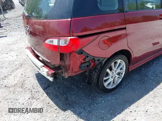 2012 Mazda 5 Grand Touring with VIN JM1CW2DL1C0123418, listed as a IAAI auction lot 42126956 with 112,411 mi miles and . Bid and sale history available at DreamBid. Image 21.