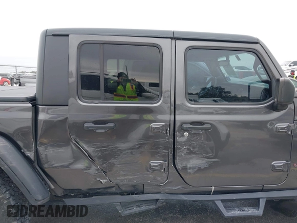 2020 Jeep Gladiator Rubicon with VIN 1C6JJTBG8LL135573, listed as a IAAI auction lot 41585896 with 79,070 mi miles and . Bid and sale history available at DreamBid. Image 6.