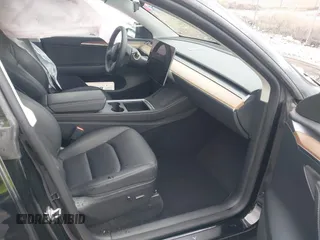2023 Tesla Model Y Long Range with VIN 7SAYGDEE5PF766685, listed as a IAAI auction lot 41933729 with 25,959 mi miles and . Bid and sale history available at DreamBid. Image 5.