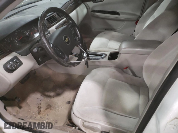 2014 Chevrolet Impala LT with VIN 2G1WB5E37E1100847, listed as a Copart auction lot 58580765 with 104,949 mi miles and Salvage title. Bid and sale history available at DreamBid. Image 7.