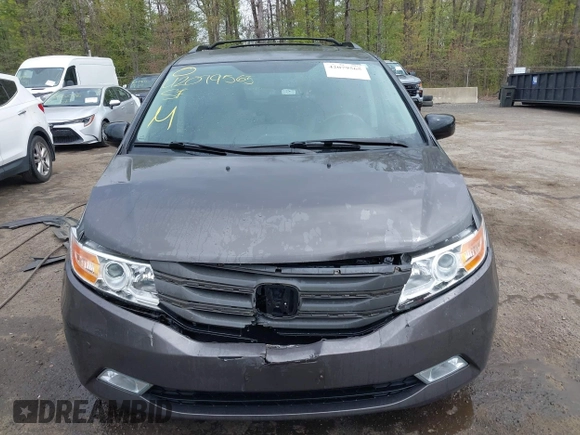 2013 Honda Odyssey Touring with VIN 5FNRL5H94DB013310, listed as a IAAI auction lot 42079565 with 128,622 mi miles and . Bid and sale history available at carsss.com. Image 12.