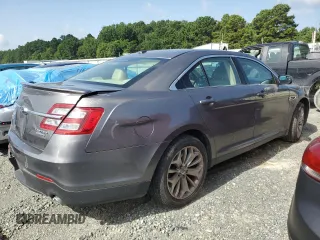2014 Ford Taurus Limited with VIN 1FAHP2F84EG149622, listed as a Copart auction lot 63764675 with 208,801 mi miles and Salvage title. Bid and sale history available at DreamBid. Image 3.