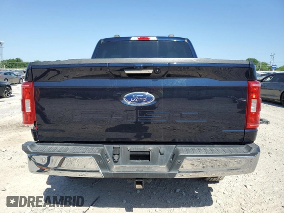 2021 Ford F-150 XL with VIN 1FTFW1E5XMFA47980, listed as a Copart auction lot 56737215 with 63,781 mi miles and Salvage title. Bid and sale history available at DreamBid. Image 6.