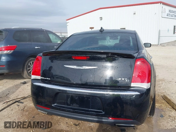 2015 Chrysler 300 C with VIN 2C3CCAEG8FH908477, listed as a IAAI auction lot 41702256 with 140,017 mi miles and . Bid and sale history available at carsss.com. Image 16.