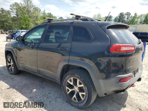 2014 Jeep Cherokee Trailhawk with VIN 1C4PJMBS1EW242527, listed as a Copart auction lot 53160485 with 104,074 mi miles and Salvage Title. Bid and sale history available at carsss.com. Image 2.