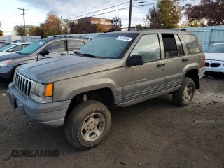 1997 Jeep Grand Cherokee Laredo with VIN 1J4GZ58S1VC741586, listed as a Copart auction lot 77619394 with 0 mi miles and Clean Title. Bid and sale history available at carsss.com. Image 1.