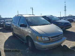 2000 Toyota Sienna LE with VIN 4T3ZF13C2YU288743, listed as a IAAI auction lot 41486156 with 242,957 mi miles. Bid and sale history available at carsss.com. Image 1.