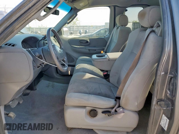 2002 Ford F-150 XL with VIN 1FTPX18L32NB65156, listed as a Copart auction lot 61418955 with 176,622 mi miles and Salvage title. Bid and sale history available at DreamBid. Image 7.