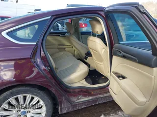 2013 Ford Fusion SE Hybrid z VIN 3FA6P0LU1DR251738, wystawiony jako IAAI lot #41576698 z przebiegiem 158 735 mil mil oraz . Historia ofert i sprzedaży dostępna na DreamBid. Obrazek 8.