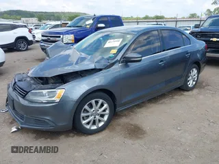 2014 Volkswagen Jetta Sedan SE with VIN 3VWD07AJ7EM238799, listed as a IAAI auction lot 40234990 with 113,297 mi miles. Bid and sale history available at carsss.com. Image 2.