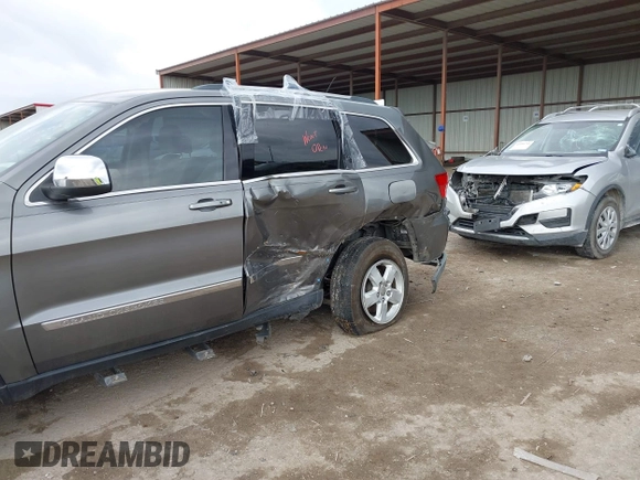 2013 Jeep Grand Cherokee Laredo with VIN 1C4RJEAG2DC571569, listed as a IAAI auction lot 41100518 with 98,265 mi miles. Bid and sale history available at carsss.com. Image 6.