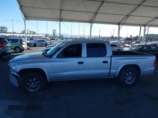 2003 Dodge Dakota SLT with VIN 1D7HL48N13S294573, listed as a IAAI auction lot 41291127 with 227,355 mi miles. Bid and sale history available at carsss.com. Image 14.