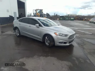 2015 Ford Fusion Energi Titanium with VIN 3FA6P0SU1FR293900, listed as a IAAI auction lot 41054751 with 173,930 mi miles. Bid and sale history available at carsss.com. Image 1.
