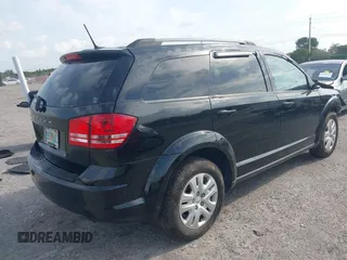2017 Dodge Journey SE with VIN 3C4PDCAB4HT691343, listed as a IAAI auction lot 41863725 with 99,519 mi miles and . Bid and sale history available at carsss.com. Image 4.