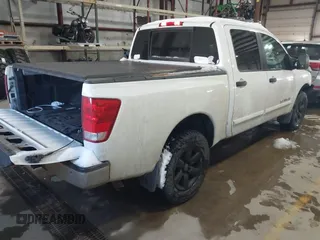 2014 Nissan Titan S with VIN 1N6AA0EC2EN512337, listed as a IAAI auction lot 41337837 with 187,540 mi miles and . Bid and sale history available at DreamBid. Image 4.