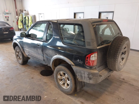 2002 Isuzu Rodeo with VIN 4S2CM57W124335034, listed as a IAAI auction lot 42446556 with 214,718 mi miles and . Bid and sale history available at DreamBid. Image 3.