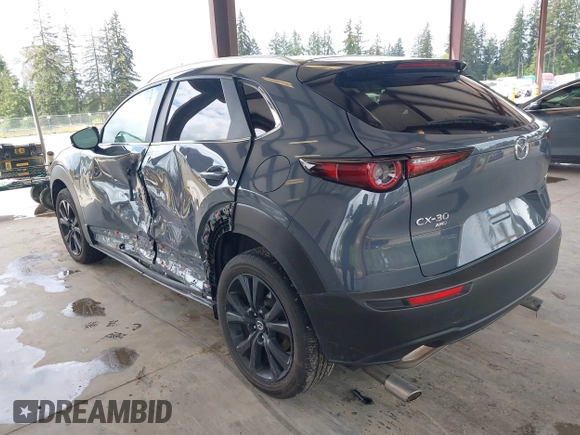 2023 Mazda CX-30 S Carbon Edition with VIN 3MVDMBCM1PM558865, listed as a IAAI auction lot 42298416 with 19,276 mi miles and . Bid and sale history available at DreamBid. Image 3.