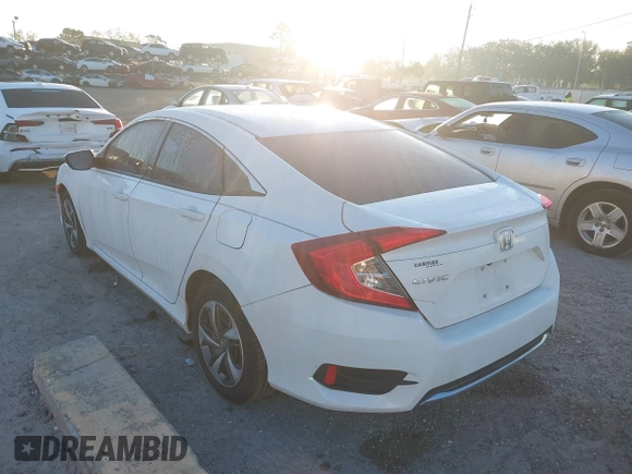 2019 Honda Civic LX with VIN 19XFC2F61KE014007, listed as a IAAI auction lot 41795070 with 64,259 mi miles and . Bid and sale history available at DreamBid. Image 3.