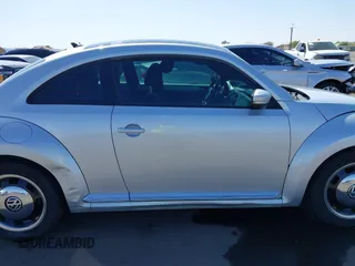 2013 Volkswagen Beetle 2.5L w/Sun/Sound/Nav with VIN 3VWJX7AT5DM606119, listed as a IAAI auction lot 41970253 with 81,004 mi miles and . Bid and sale history available at DreamBid. Image 14.