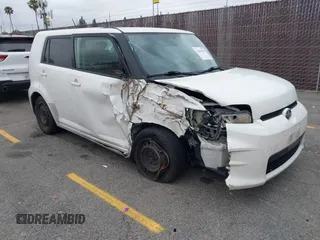 2014 Scion xB with VIN JTLZE4FEXEJ054060, listed as a IAAI auction lot 42096159 with 211,994 mi miles. Bid and sale history available at carsss.com. Image 1.