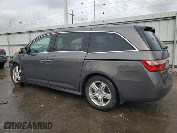 2012 Honda Odyssey Touring with VIN 5FNRL5H94CB109257, listed as a Copart auction lot 59636075 with 107,543 mi miles and Salvage title. Bid and sale history available at DreamBid. Image 2.