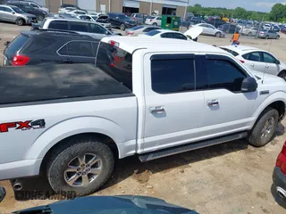 2018 Ford F-150 XL with VIN 1FTEW1EP9JKE58173, listed as a IAAI auction lot 42389998 with 129,512 mi miles and . Bid and sale history available at DreamBid. Image 14.