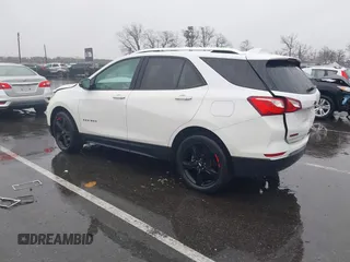 2021 Chevrolet Equinox Premier z VIN 2GNAXNEV7M6112087, wystawiony jako IAAI lot #41102702 z przebiegiem 32 995 mil mil oraz . Historia ofert i sprzedaży dostępna na DreamBid. Obrazek 3.
