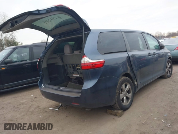 2015 Toyota Sienna L with VIN 5TDZK3DC6FS542457, listed as a IAAI auction lot 41072508 with 167,509 mi miles and . Bid and sale history available at DreamBid. Image 4.