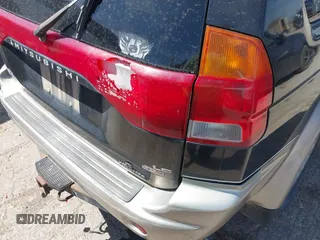 1998 Mitsubishi Montero LS z VIN JA4MT31P9WP005522, wystawiony jako IAAI lot #42047242 z przebiegiem Nie podano mil oraz . Historia ofert i sprzedaży dostępna na DreamBid. Obrazek 6.