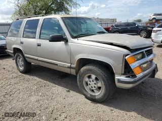 1999 Chevrolet Tahoe Z71 with VIN 1GNEK13R0XJ444734, listed as a Copart auction lot 76323384 with 160,631 mi miles and Salvage Title. Bid and sale history available at carsss.com. Image 4.