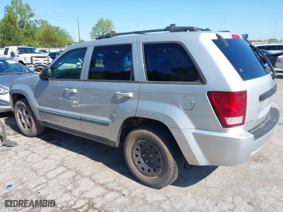 2009 Jeep Grand Cherokee Laredo with VIN 1J8GS48K99C528145, listed as a IAAI auction lot 42077024 with 167,588 mi miles. Bid and sale history available at carsss.com. Image 3.