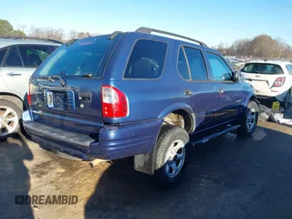 2004 Isuzu Rodeo S with VIN 4S2CK58W444314265, listed as a IAAI auction lot 41294636 with 291,080 mi miles and . Bid and sale history available at DreamBid. Image 4.