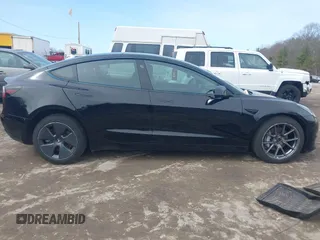 2022 Tesla Model 3 Long Range with VIN 5YJ3E1EBXNF177128, listed as a IAAI auction lot 41966089 with 75,140 mi miles and . Bid and sale history available at DreamBid. Image 13.