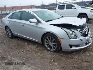 2013 Cadillac XTS Luxury z VIN 2G61P5S3XD9182910, wystawiony jako IAAI lot #41940764 z przebiegiem 21 610 mil mil oraz . Historia ofert i sprzedaży dostępna na DreamBid. Obrazek 1.